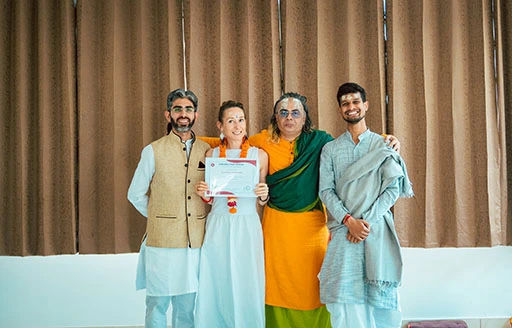 Corinne Germann, student of Nirvana Yoga School, Rishikesh receiving her 200 hour Hatha Ashtanga Vinyasa Yoga Teacher Training certification	